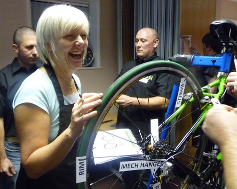 Woman enjoying bike maintenance workshop